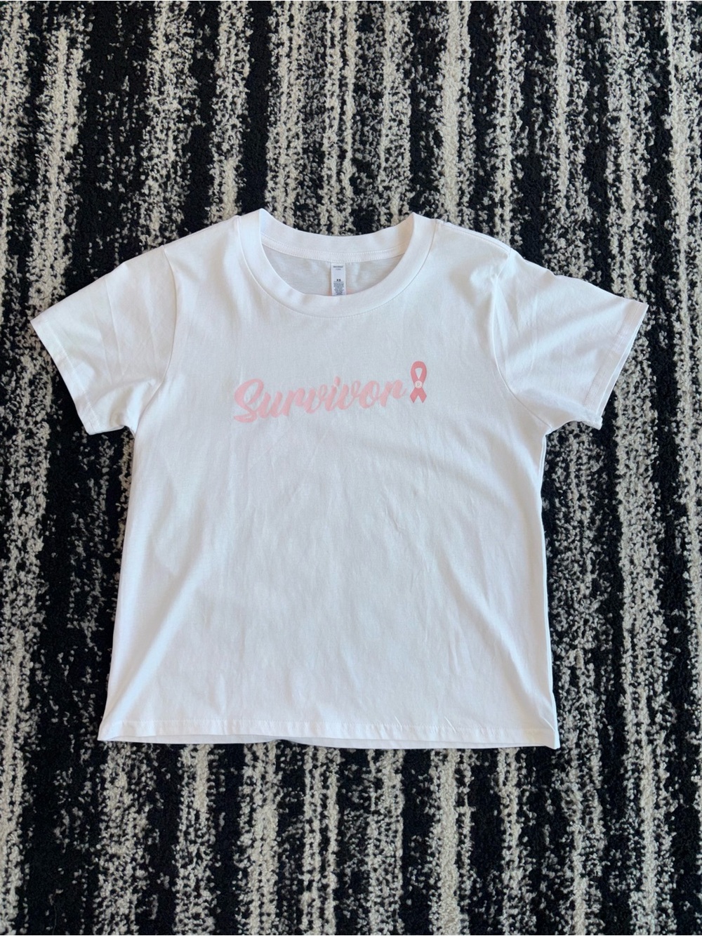 Pure Barre White Tee with Pink "Survivor" Script